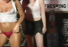 A few pretty girls expose their tits at a Wet T-shirt show
